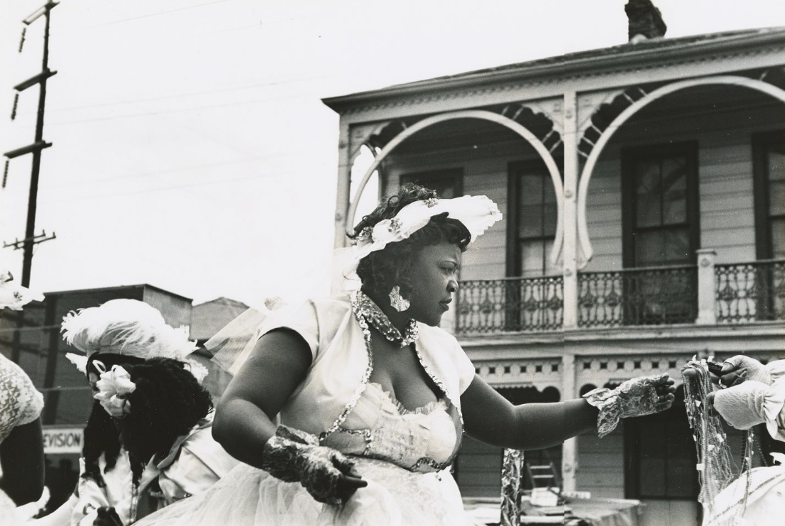 Woman at the Zulu Parade, 1954, New Orleans, Ralston Crawford collection of New Orleans jazz photographs, Tulane University Special Collections