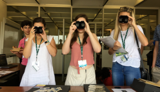 Students looking through photo viewers at The Latin American Library