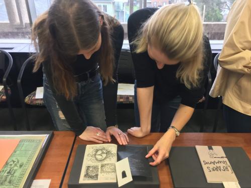 Students examining rare materials