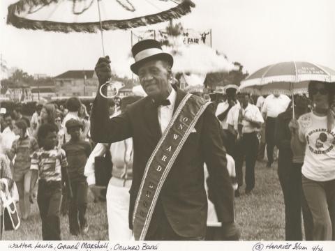 Photo: Grand Marshall Walter Lewis marches with the Onward Brass Band at Jazz Fest, 1976, photographer: Harriet Blum, Hogan Archive Photography Collection, PH003075, Tulane University Special Collections.